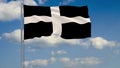 Kernow - Cornwall flag against background of clouds floating on the blue sky