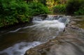 Kerosene creek nature hot water pool with waterfall