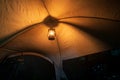 Kerosene lamp inside the tent at night