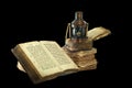 Kerosene lamp and old books.