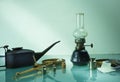 Kerosene lamp, scales, weights, a watering can with oil. space for text Royalty Free Stock Photo