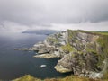 Kerry Cliffs (Aillte Chiarrai) in front of the ocean with a dramatic sky in the background, Ireland Royalty Free Stock Photo