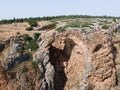 The Keshet  Cave - ancient natural limestone arch spanning the remains of a shallow cave with sweeping views near Shlomi city in Royalty Free Stock Photo