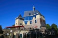 View on old medieval castle with modern new elements against blue summer sky