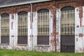 Kessel-Lo, Flemish Brabant, Belgium - Worn brick stone facade of the Hal 5, a former industrial site for the maintenance of trains