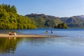 Swimmers and bathers in Derwentwater at the town of Keswick in the Lake District National Park