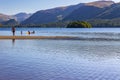 KESWICK,ENGLAND - AUGUST 10 2023 - Swimmers and bathers in Derwentwater at the town of Keswick in the Lake District National Park