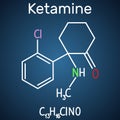Ketamine molecule. It is used for anesthesia in medicine. Structural chemical formula and molecule model on the dark blue Royalty Free Stock Photo