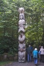 Ketchikan, Alaska: Visitors tour the grounds of Potlatch Totem Park Royalty Free Stock Photo