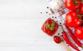 Ketchup and ingredients: tomatoes, garlic and red hot pepper on a wooden white background. Close-up. Top view. Copy space Royalty Free Stock Photo