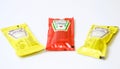 Ketchup and mustard from Heinz brand in sachets Royalty Free Stock Photo