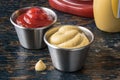 Ketchup and Mustard in Condiment Cups