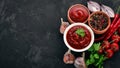 Ketchup sauce in a bowl. Cherry tomatoes, spices, chili peppers, olive oil, parsley. Top view. Royalty Free Stock Photo