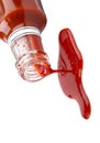 Ketchup sauce poured from the bottle into white background and generated with AI Royalty Free Stock Photo