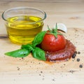 Ketchup tomato basil olive oil herbs garlic board black pepper ingredients square Royalty Free Stock Photo