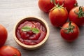 ketchup or tomato sauce with basil leaf in a wooden bowl Royalty Free Stock Photo