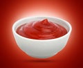 Ketchup in white bowl on red background. Portion of tomato sauce. With clipping path.