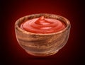 Ketchup in wooden bowl . Portion of tomato sauce. With clipping path. Royalty Free Stock Photo