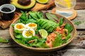 Keto bowl salmon salad with greens, eggs and avocado. Ketogenic diet breakfast lunch. Top view