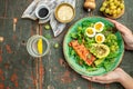 Keto bowl salmon salad with greens, eggs and avocado. Ketogenic diet breakfast lunch. Top view Royalty Free Stock Photo