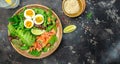 Keto bowl salmon salad with greens, eggs and avocado. Ketogenic diet breakfast lunch. Top view