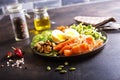 Keto bowl salmon salad with greens, eggs and nuts