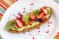 Keto diet avocado toast with strawberries, soft cheese, sesame seeds and herbs. healthy Breakfast or lunch. sandwich Royalty Free Stock Photo