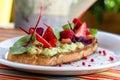 Keto diet avocado toast with strawberries, soft cheese, sesame seeds and herbs. healthy Breakfast or lunch. sandwich Royalty Free Stock Photo