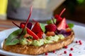 Keto diet avocado toast with strawberries, soft cheese, sesame seeds and herbs. healthy Breakfast or lunch. sandwich Royalty Free Stock Photo