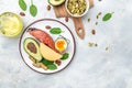 Keto diet food, salmon, avocado, cheese, egg, spinach and nuts. Ketogenic low carbs diet concept. Ingredients for healthy foods Royalty Free Stock Photo