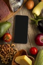 Keto diet inscription and food and smartphone . Healthy products