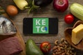 Keto Diet Recipes logo app on smartphone. Diet Plan On Tablet Pc And Vegetables. Belgorod , Russia - AUG, 18, 2020