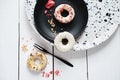 keto donuts with glaze and sprinkles of sublimated strawberry. low carb ketogenic meal. sugarless doughnuts with various