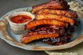 Keto food, spicy barbecue pork ribs. Slow cooking recipe. Pickled Roasted Pork Meat with red sauce Royalty Free Stock Photo