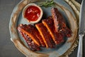 Keto food, spicy barbecue pork ribs. Slow cooking recipe. Pickled Roasted Pork Meat with red sauce