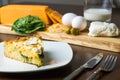 Keto homemade goat cheese and spinach pie with ingredients.  Close up Royalty Free Stock Photo