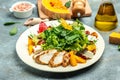 keto meal fresh salad with grilled chicken fillet, feta cheese, caramelized pumpkin, superfood concept. Healthy, clean eating, Royalty Free Stock Photo