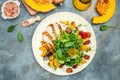 Keto meal fresh salad with grilled chicken fillet, feta cheese, caramelized pumpkin, superfood concept. Healthy, clean eating, Royalty Free Stock Photo