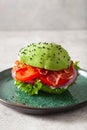 Keto paleo diet avocado burger with bacon, lettuce, tomato Royalty Free Stock Photo