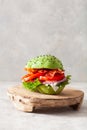 Keto paleo diet avocado burger with bacon, lettuce, tomato Royalty Free Stock Photo