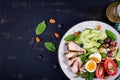 Ketogenic diet.  Boiled egg, pork steak and olives, cucumber, spinach, brie cheese, nuts and tomato. Top view Royalty Free Stock Photo