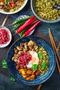 Ketogenic diet bowl with organic cauliflower and broccoli rice, stir fried chicken, mushrooms, egg and onions