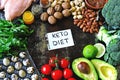 Ketogenic diet concept. A set of products of the low carb keto diet. Green vegetables, nuts, chicken fillet, flax seeds, quail egg Royalty Free Stock Photo
