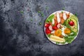 Ketogenic diet. Fried egg, avocado, strawberry, grilled chicken fillet, cheese, nuts and arugula on a dark background, Low carb Royalty Free Stock Photo
