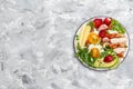 Ketogenic diet. Fried egg, avocado, strawberry, grilled chicken fillet, cheese, nuts and arugula, Low carb high fat breakfast, top Royalty Free Stock Photo