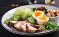 Ketogenic diet. Boiled egg, pork steak and olives, cucumber, spinach, brie cheese, nuts and blueberry Royalty Free Stock Photo