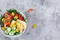 Ketogenic, keto diet. Salted salmon, grilled halloumi cheese, cherry tomatoes and cucumber salad with olives in white bowl. Royalty Free Stock Photo