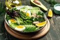 Ketogenic low carbs diet, Plate with keto foods: two eggs, avocado, tuna, cucumber and fresh salad. Healthy fats, clean eating for