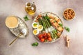 Ketogenic menu. Baked chicken breast wrapped in bacon with asparagus, eggs and tomatoes. bulletproof coffee with MCT coconut oil. Royalty Free Stock Photo