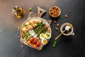 Ketogenic menu. Baked chicken breast wrapped in bacon with asparagus, eggs and tomatoes. bulletproof coffee with MCT coconut oil. Royalty Free Stock Photo